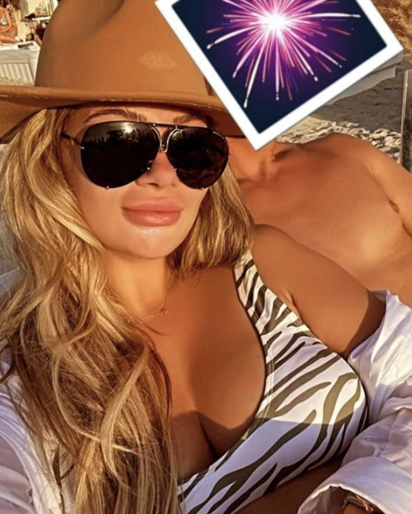 The reality TV favourite cosied up with the topless mystery man for a New Year appreciation snap, revealing she'd been with him since the previous year.